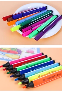 Macro view showing a set of 12 vibrant triangular watercolor pens with fine nibs for art