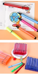 Detail of triangular watercolor markers set with fiber tips and matching color caps