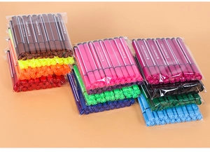 Detail of dual-tip watercolor pens in multiple colors with triangular barrel design