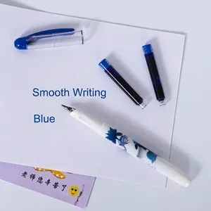 White ceramic style fountain pen with blue floral patterns and two ink refills
