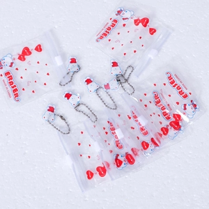 Detailed view of mini PVC zipper bags for erasers with cartoon bears and silver bead chains