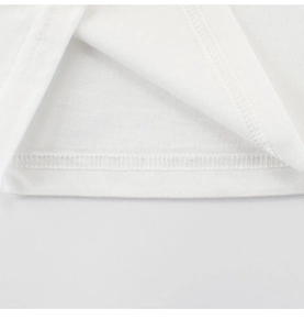 Detail of double-needle stitching and smooth hemline on white cotton kids T-shirt