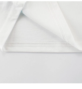 Close-up of white cotton t-shirt hem featuring professional double-needle stitching