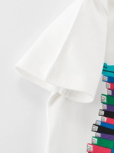 White cotton t-shirt for boys featuring a colorful cartoon book print and short sleeves
