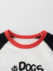 Kids' raglan sleeve cotton T-shirt with 'DOGS' print and red ribbed crew neck collar
