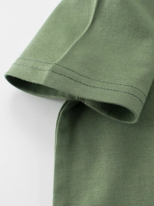 Close-up of olive green kids' cotton T-shirt showing detailed stitching and fabric