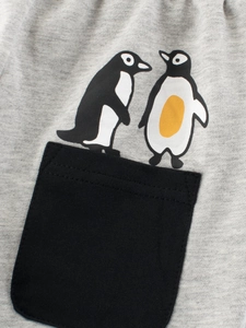 Boys' grey knit cotton shorts with cute cartoon penguin prints and a black pocket