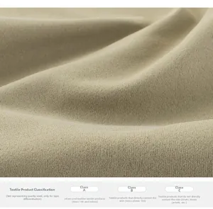 Close-up of quick-dry beige knit fabric showing soft texture and safety class labels