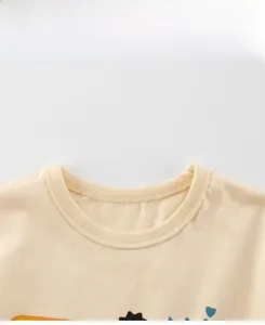 Close-up of ribbed crew neck on beige cotton T-shirt with neat double-needle stitching