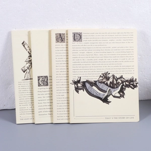 Detalle de cuatro cuadernos beige con tipografía vintage e ilustraciones artísticas