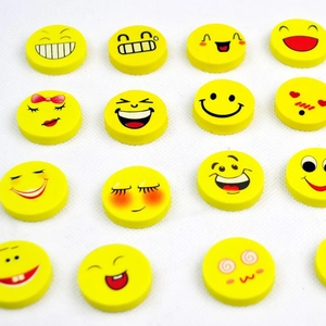Collection of yellow round smiley face erasers with various fun expressions for school students