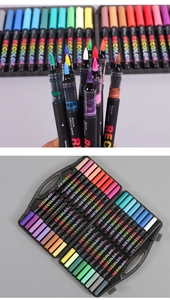Detail of colorful acrylic markers with soft tips in a black portable carrying case