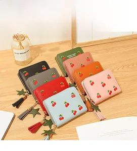 Detail of short wallets featuring cherry embroidery and stylish fringe tassels in seven colors