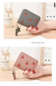 Detail of cherry embroidery and star tassel zipper on the short zip wallet