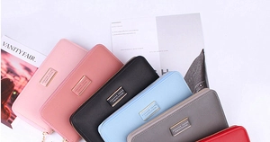 Detailed view of multi-color long zip wallets with textured leather and metal plates