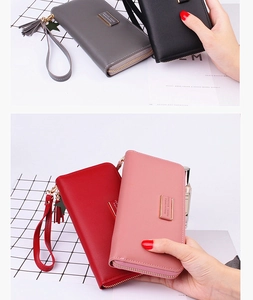 Detailed view of long PU leather wallets with star fringe charms and wrist straps