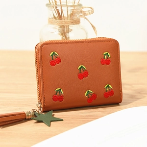 Brown short wallet with cherry embroidery, tassel zipper, and green star pendant