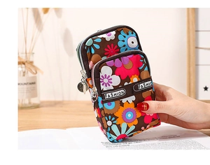 Detailed macro view of triple-layered floral waterproof sports phone bag with sturdy zippers