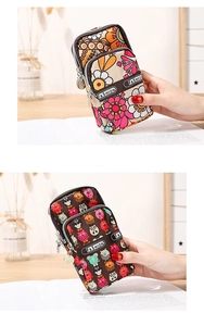 Three-layer floral and owl print sports wristlet bag with triple zippers and durable canvas