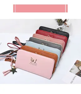 Detail of colorful zip-around long wallets with butterfly metal buckle and star tassel charm