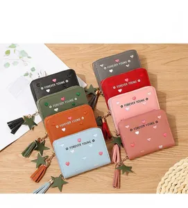 Close-up of long women's wallet colors featuring heart embroidery and tassel star charms