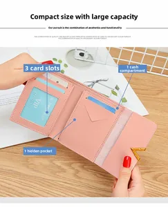 Detail view of pink trifold wallet interior showing card slots and currency pocket