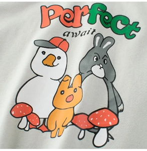 Close-up of cute cartoon duck and animal prints on light grey cotton kids t-shirt