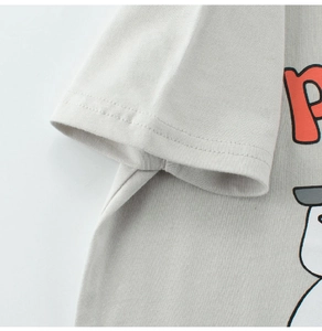 Detailed view of grey kids cotton T-shirt featuring high-quality stitching and graphic print
