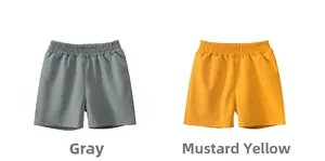Flat lay detail of grey and mustard yellow quick-dry elastic waist casual shorts