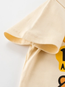 Boys' beige short-sleeved cotton T-shirt showing detailed sleeve stitching and soft knit fabric
