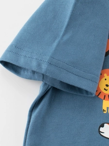 Close-up of blue cotton kids T-shirt sleeve with lion print and durable stitching