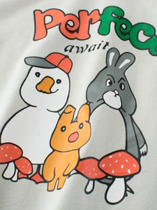 Close-up of cute cartoon duck and rabbit print on light gray cotton boy's t-shirt