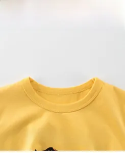 Close-up of yellow cotton t-shirt neckline with Active Braves graphic print