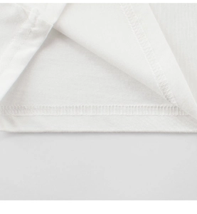 Detail of double-needle stitching on white cotton kids t-shirt hem with clean finish