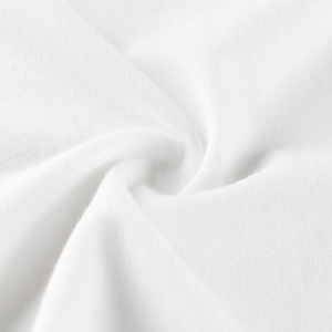 Close-up of premium white knitted cotton fabric showing soft texture and breathable weave