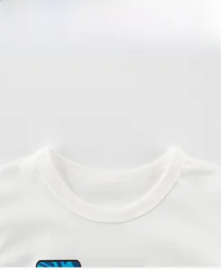 Detail view of the white round neck and high-quality stitching on kids' cotton t-shirt