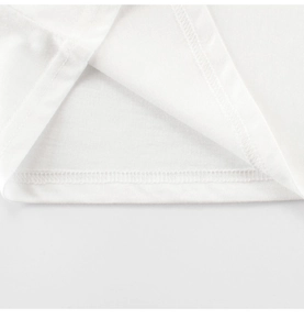 Close-up of double-needle stitching on the hem of a white cotton boys' t-shirt