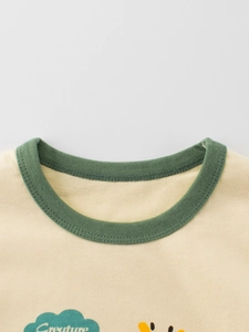 T-shirt en coton pour enfant avec col rond vert et imprimé créature dessin