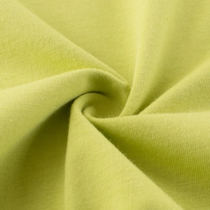 Détail du tissu en maille de coton vert citron doux pour t-shirt d'enfant