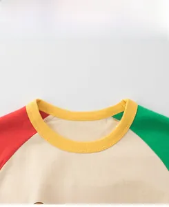 Detail of color-block crew neck with My Friend print on soft knit cotton kids t-shirt