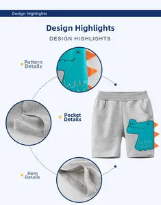 Detail of grey kids shorts featuring blue dinosaur print and orange 3D fabric scales