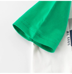 Detailed view of color-block raglan sleeves and active lettering on cotton T-shirt