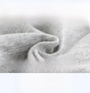Close-up of soft breathable dark gray knitted cotton fabric texture for kids shorts
