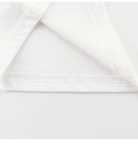 Detailed close-up of double-needle stitching on white cotton t-shirt bottom hem