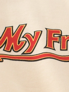 Close-up of cotton knit t-shirt featuring retro collegiate varsity print detail