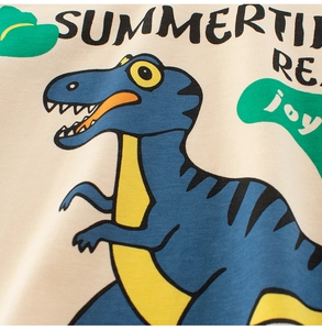 Detail of cartoon dinosaur print and high-quality cotton knit texture on toddler t-shirt
