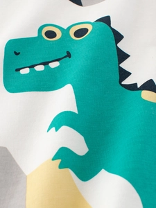 Kids white cotton T-shirt featuring a cute green cartoon dinosaur print on soft knit fabric