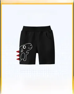 Detail of kids black shorts with white dinosaur print and red 3D side spikes decor