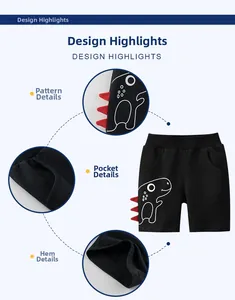 Detail of kids black shorts featuring 3D red dinosaur fins and high-quality stitching