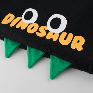 Kids black dinosaur themed knit shorts with yellow text and 3D green spine details